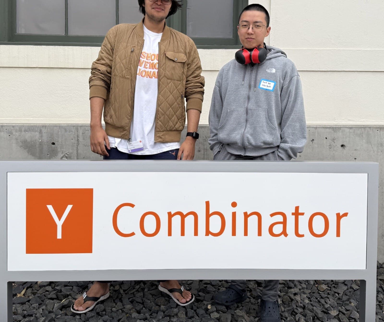 Two of the OpenTrade team outside Y Combinator